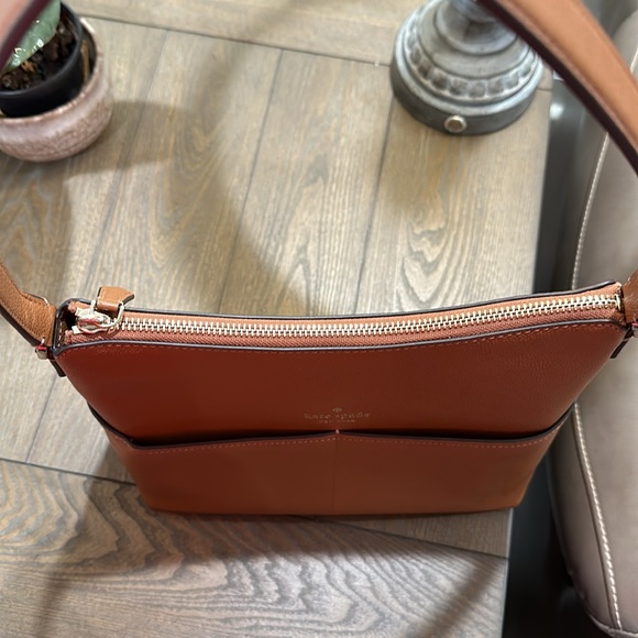 Kate Spade bucket purse with 2 front pockets. Tan leather. New W/O tags - Picture 13 of 14